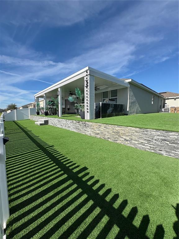 1948 Rankin Street Kissimmee, FL 34744 - Photo 26 of 37 a view of a house with a yard