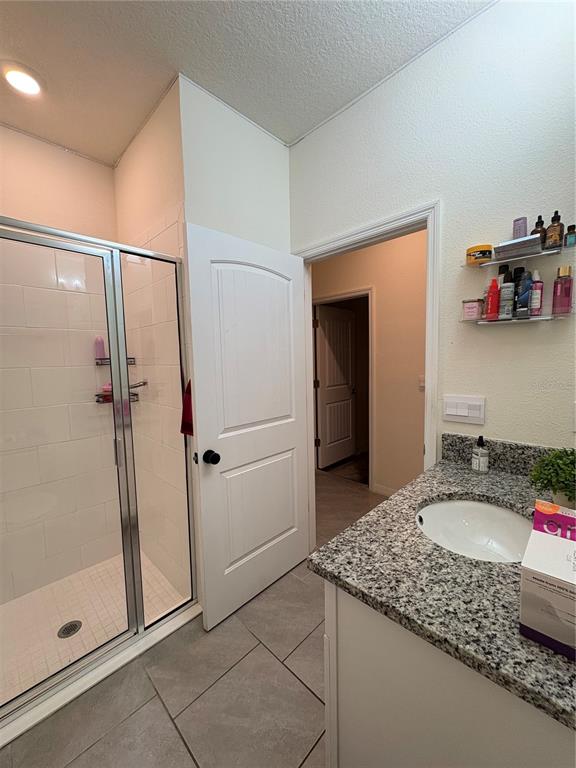 1948 Rankin Street Kissimmee, FL 34744 - Photo 33 of 37 a bathroom with a granite countertop sink and a mirror