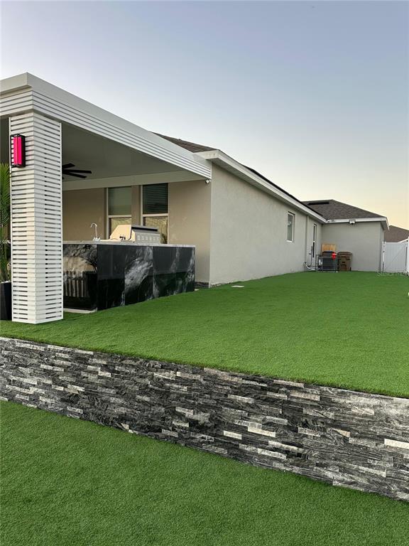 1948 Rankin Street Kissimmee, FL 34744 - Photo 35 of 37 a view of a house with a backyard