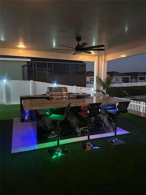 1948 Rankin Street Kissimmee, FL 34744 - Photo 36 of 37 a patio with table and chairs