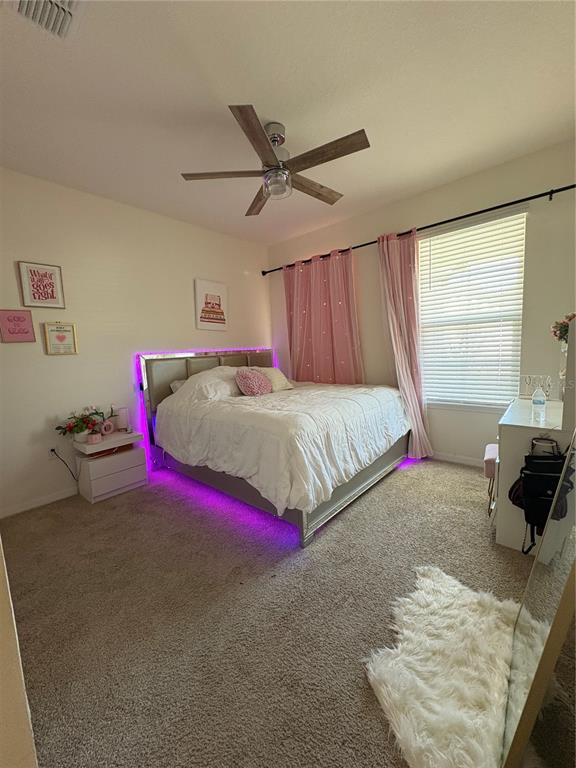 1948 Rankin Street Kissimmee, FL 34744 - Photo 6 of 37 a bedroom with a bed and a window