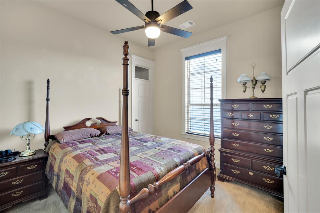 409 George Hopper Road Midlothian, TX 76065 - Photo 18 of 26 a bedroom with a bed and a closet