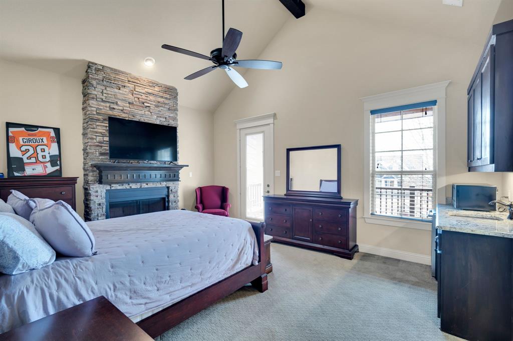 409 George Hopper Road Midlothian, TX 76065 - Photo 20 of 26 a living room with furniture and a flat screen tv