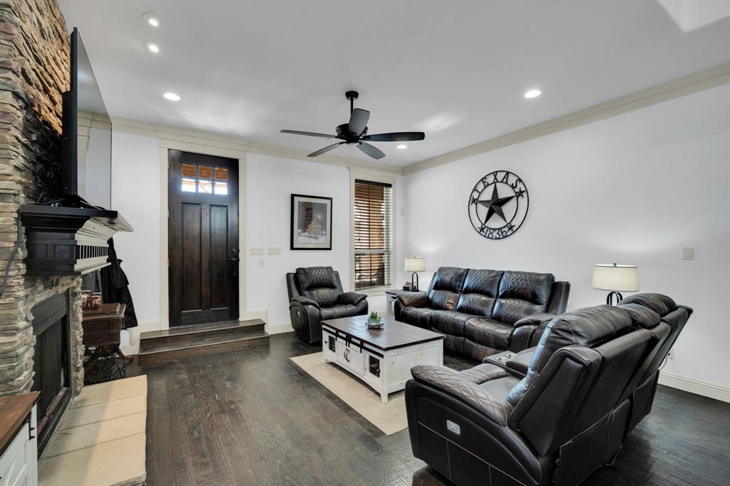 409 George Hopper Road Midlothian, TX 76065 - Photo 5 of 26 a living room with furniture a ceiling fan and a window