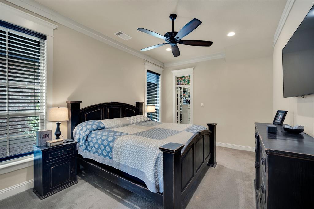 409 George Hopper Road Midlothian, TX 76065 - Photo 10 of 26 a bedroom with a bed and a flat screen tv