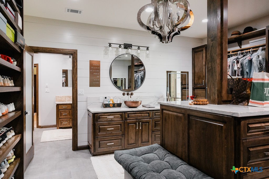 436 Jentry Road Inez, TX 77968 - Photo 14 of 42 a kitchen with a cabinets and chandelier