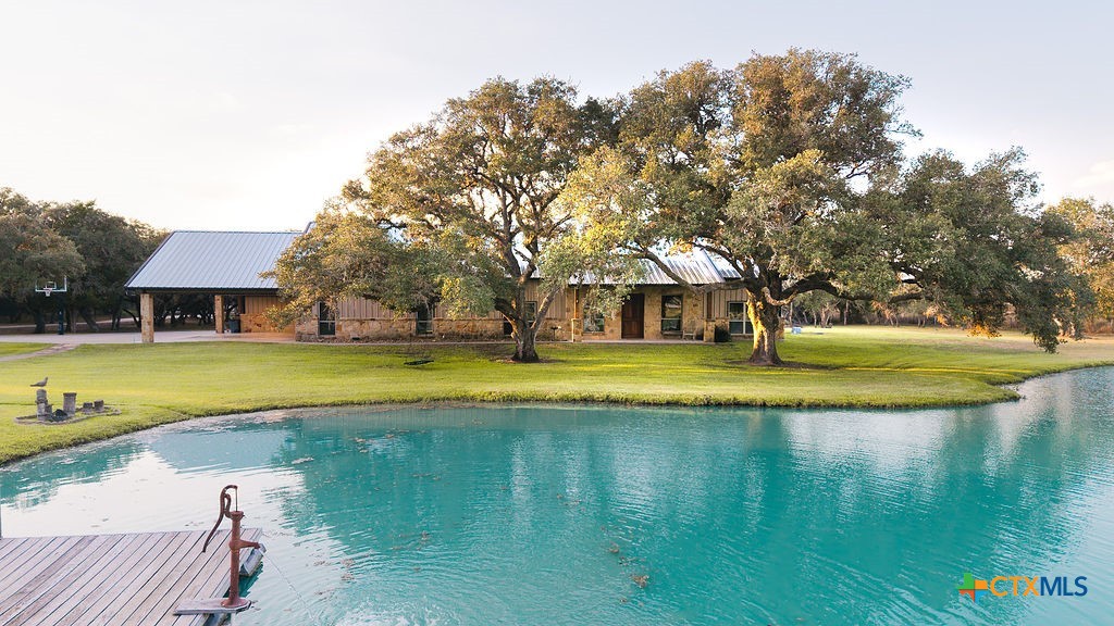 436 Jentry Road Inez, TX 77968 - Photo 2 of 42 a view of a swimming pool with house in the background