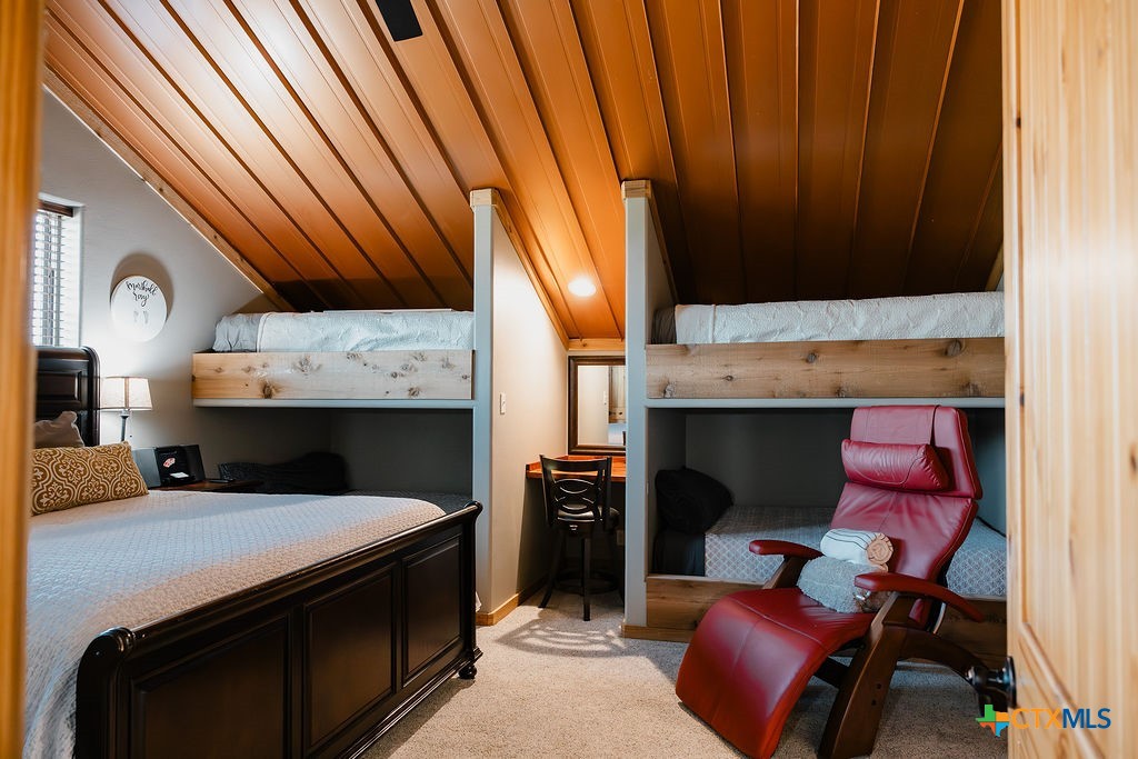 436 Jentry Road Inez, TX 77968 - Photo 23 of 42 a bed room with a bed furniture and a fireplace