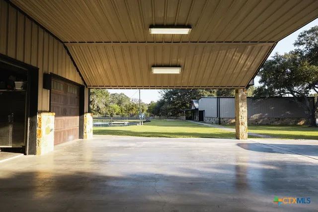 a view of a shop with parking area