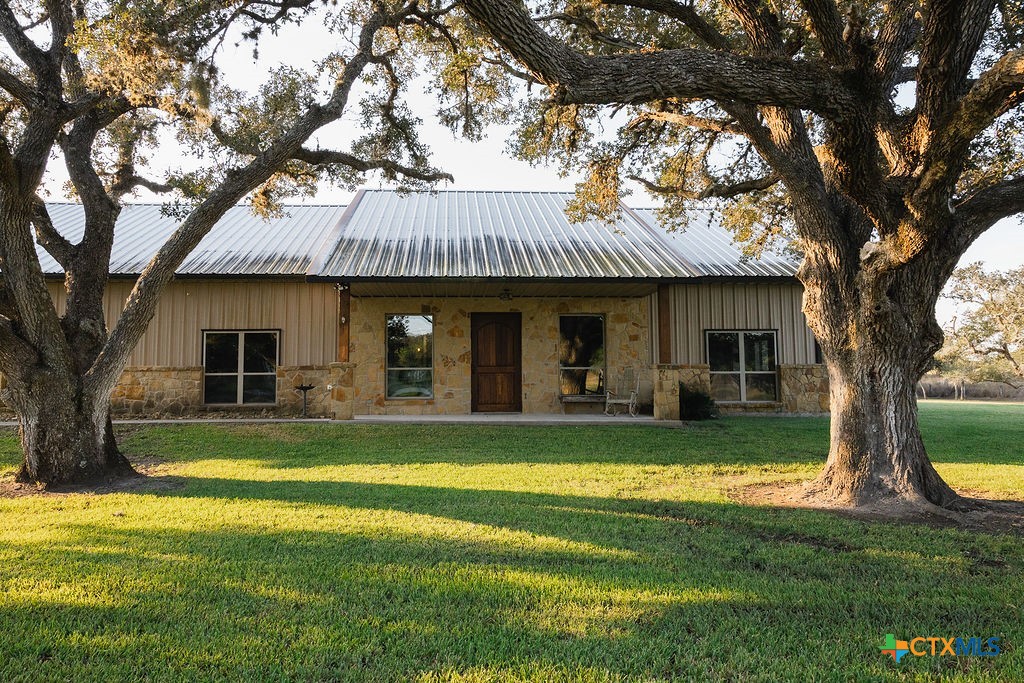436 Jentry Road Inez, TX 77968 - Photo 3 of 42 a front view of a house with swimming pool having outdoor seating