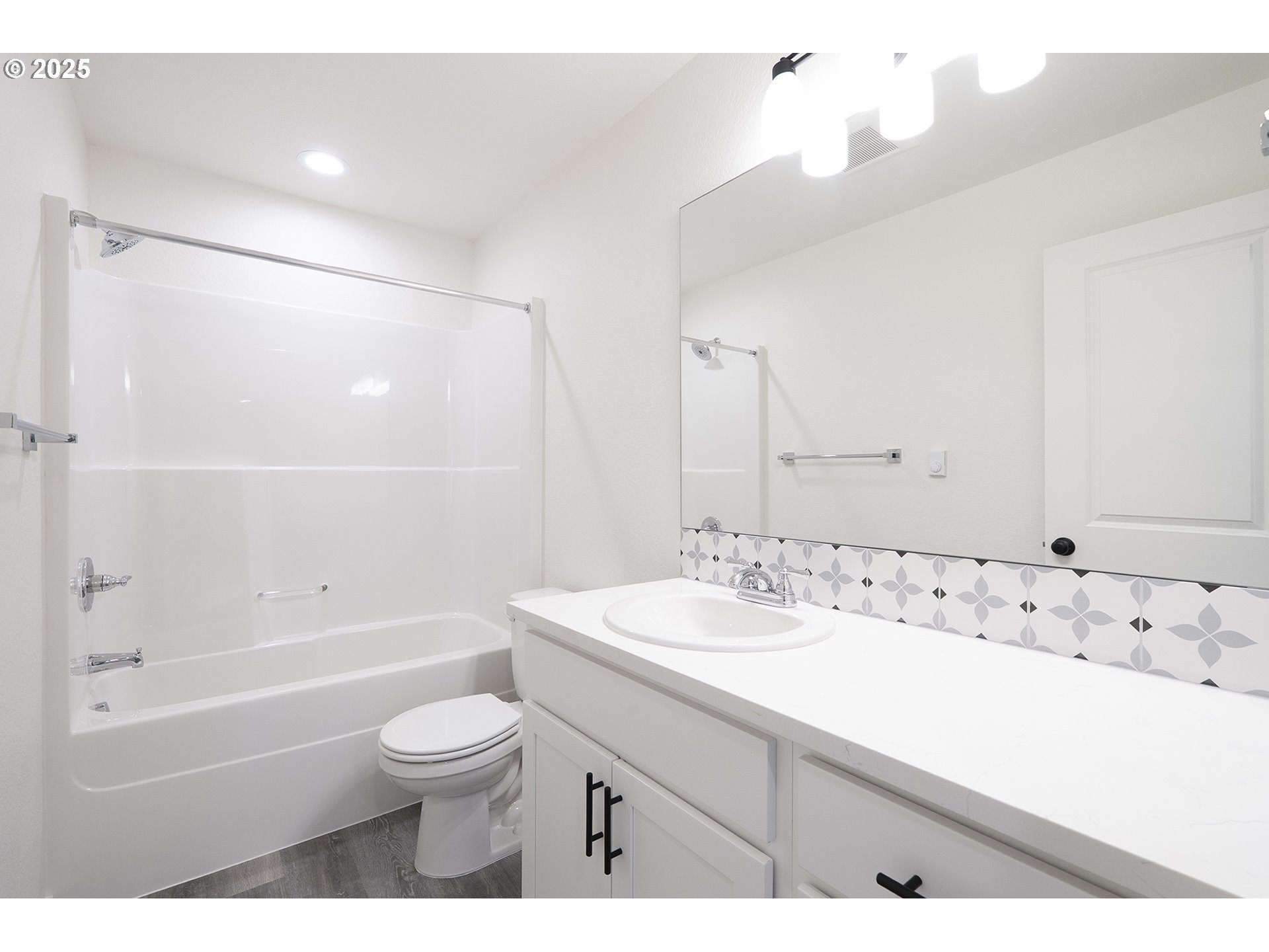 14718 Southeast Powell Boulevard Portland, OR 97236 - Photo 12 of 15 a bathroom with a sink a toilet and a bathtub