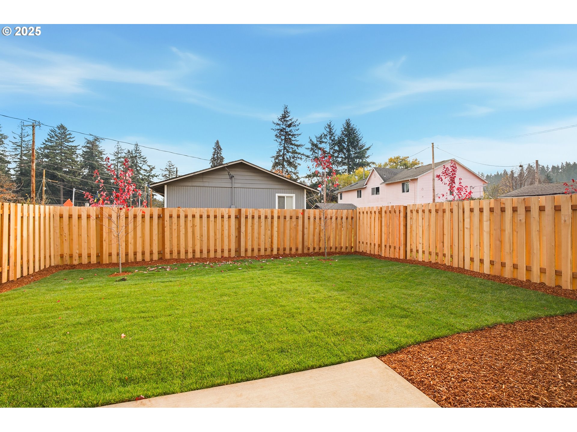 14718 Southeast Powell Boulevard Portland, OR 97236 - Photo 13 of 15 a view of a backyard with wooden fence