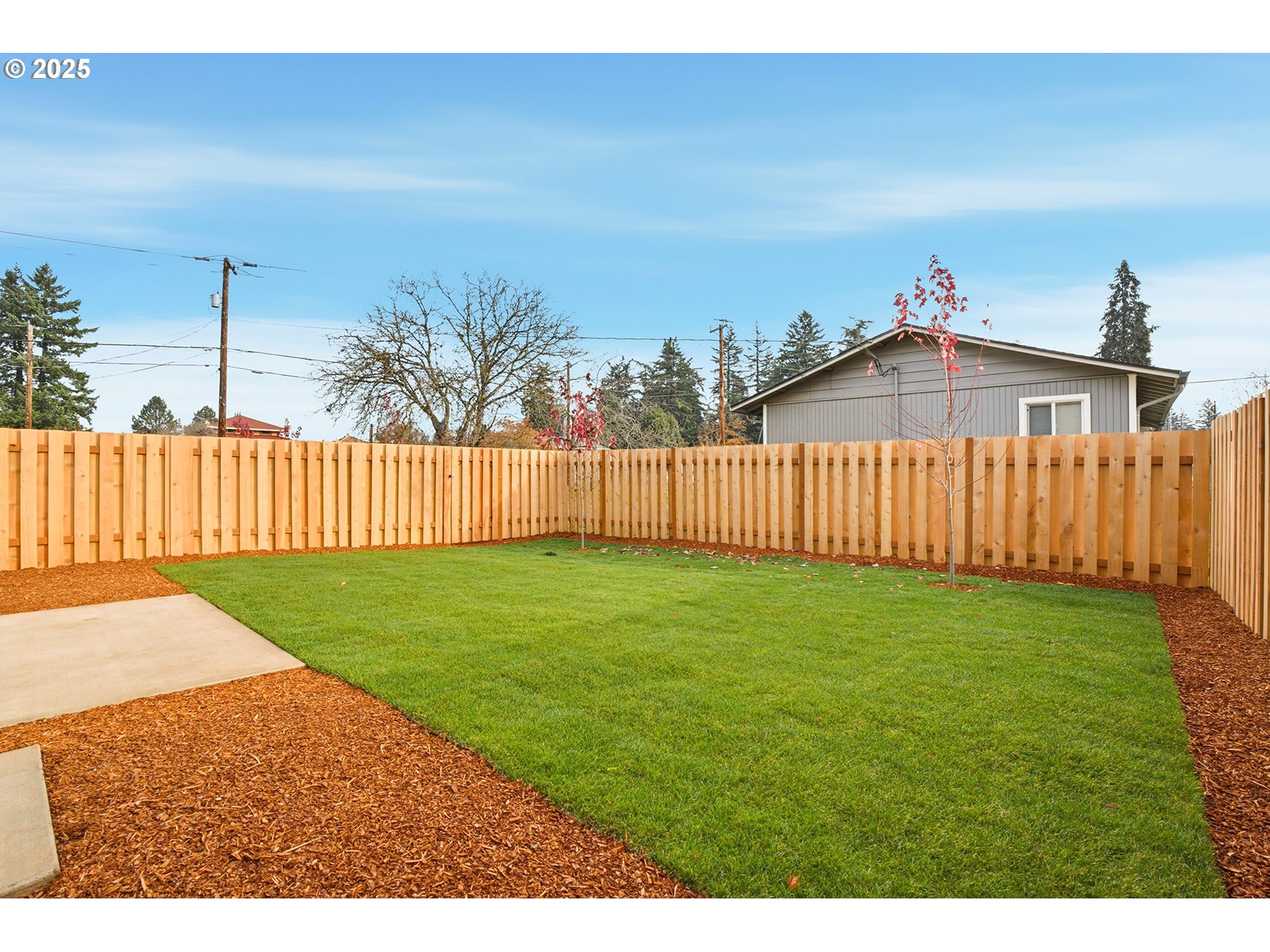 14718 Southeast Powell Boulevard Portland, OR 97236 - Photo 14 of 15 a view of a backyard with wooden fence