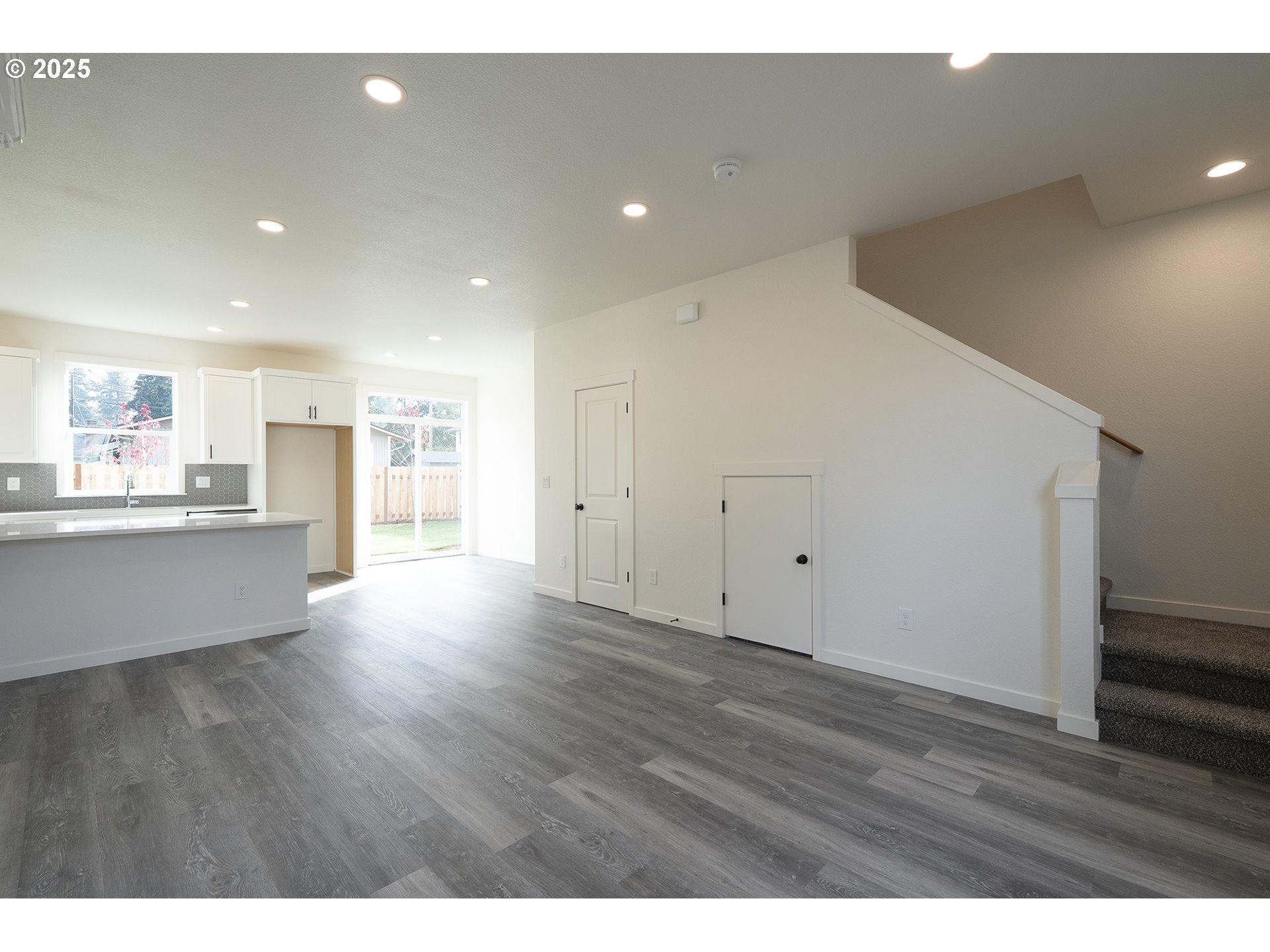 14718 Southeast Powell Boulevard Portland, OR 97236 - Photo 3 of 15 a view of an empty room with wooden floor