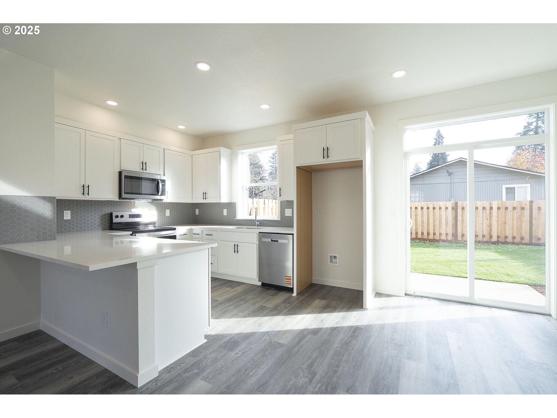 14718 Southeast Powell Boulevard Portland, OR 97236 - Photo 5 of 15 a kitchen with refrigerator and cabinets