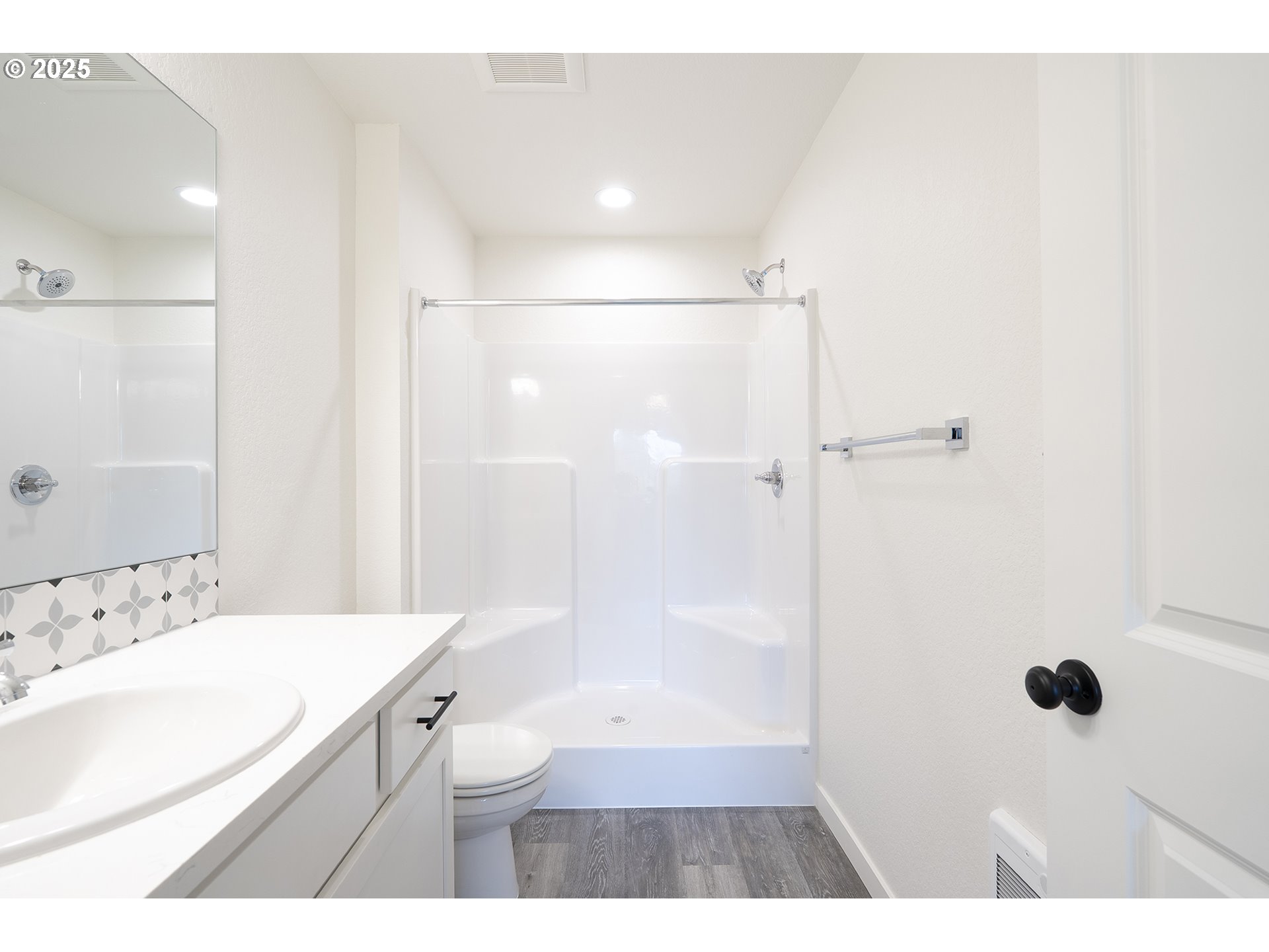 14718 Southeast Powell Boulevard Portland, OR 97236 - Photo 8 of 15 a bathroom with a sink a toilet a shower and a mirror