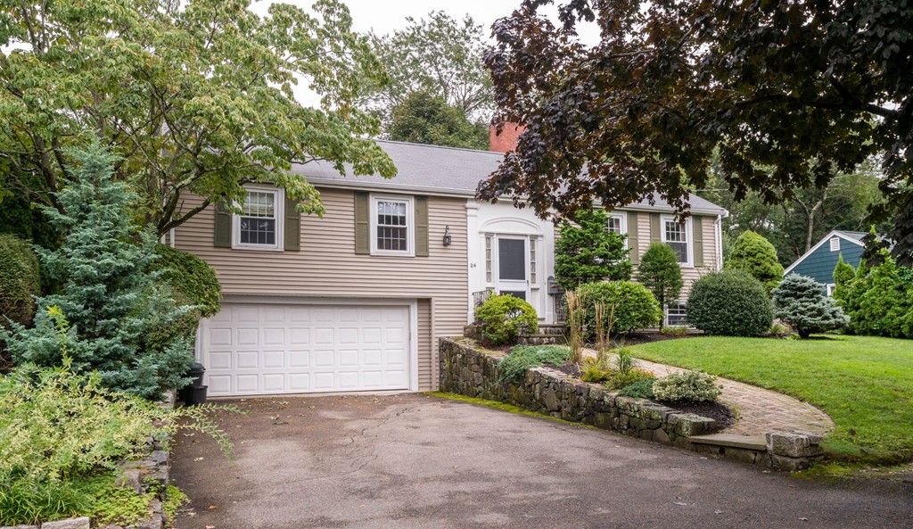 24 Hawthorn Road Marblehead, MA 01945 - Photo 1 of 30 a front view of a house with a yard and garage