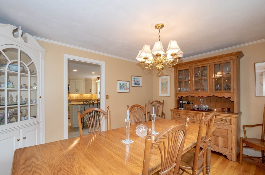 24 Hawthorn Road Marblehead, MA 01945 - Photo 18 of 30 a dining room with chandelier and wooden floor