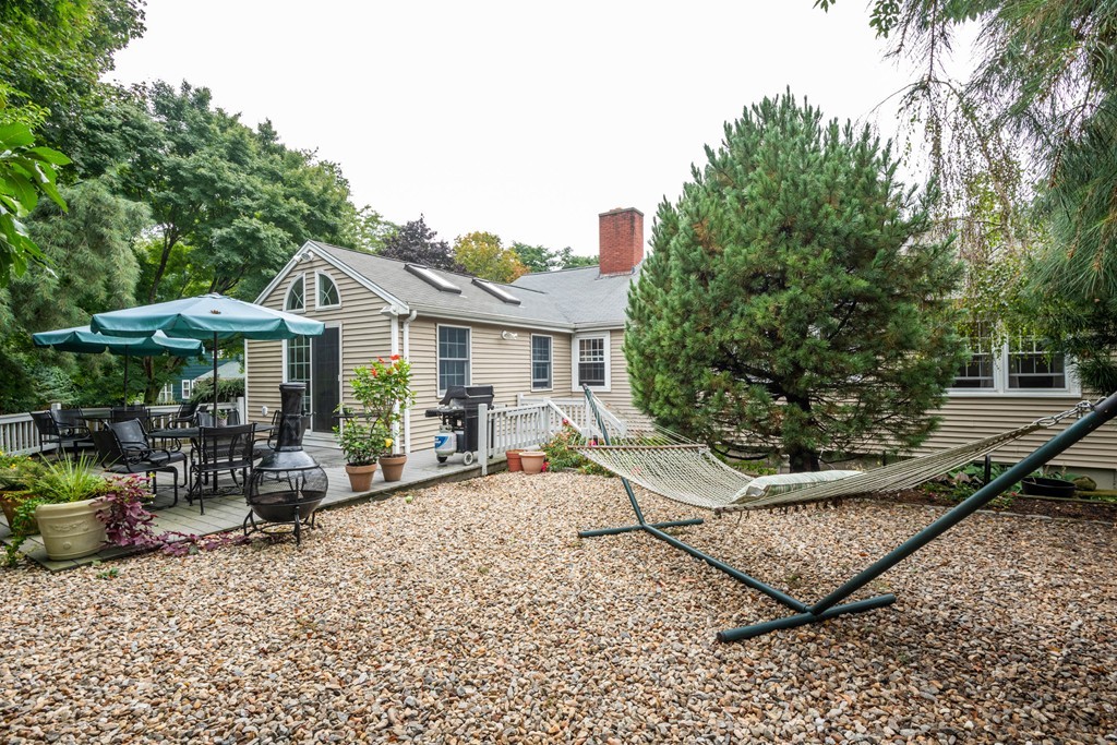 24 Hawthorn Road Marblehead, MA 01945 - Photo 2 of 30 a view of a chair and tables in the patio