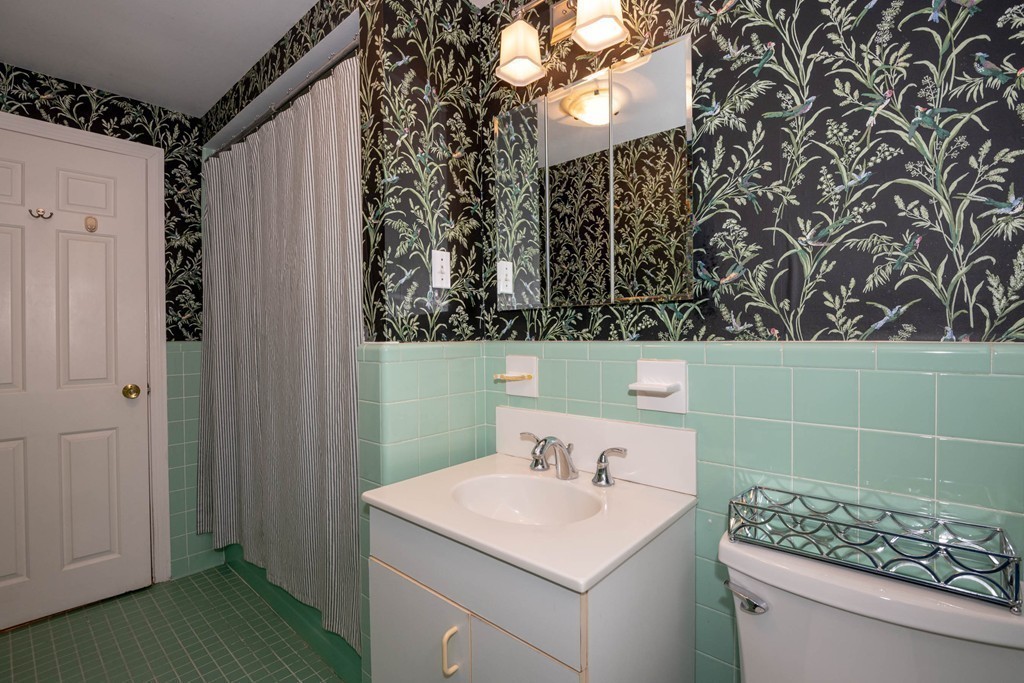 24 Hawthorn Road Marblehead, MA 01945 - Photo 26 of 30 a bathroom with a sink toilet and shower