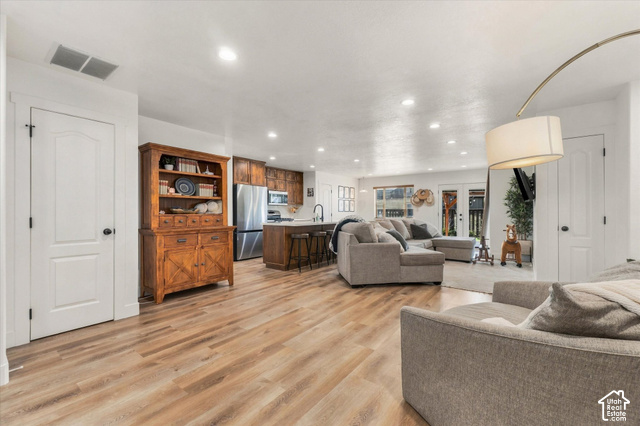 437 Scenic Heights Road Kamas, UT 84036 - Photo 7 of 46 Expansive room featuring wood-finish flooring, recessed lighting, and white trim