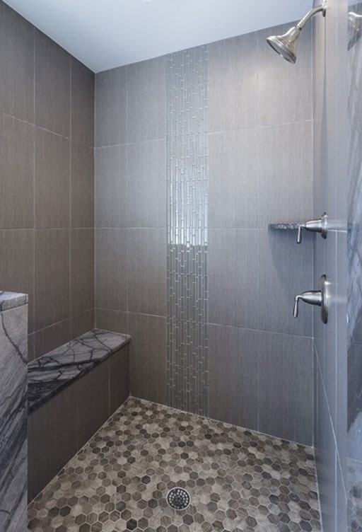 141 Ash Street, Unit 1 Waltham, MA 02453 - Photo 18 of 31 a bathroom with a granite countertop sink a vanity and a shower