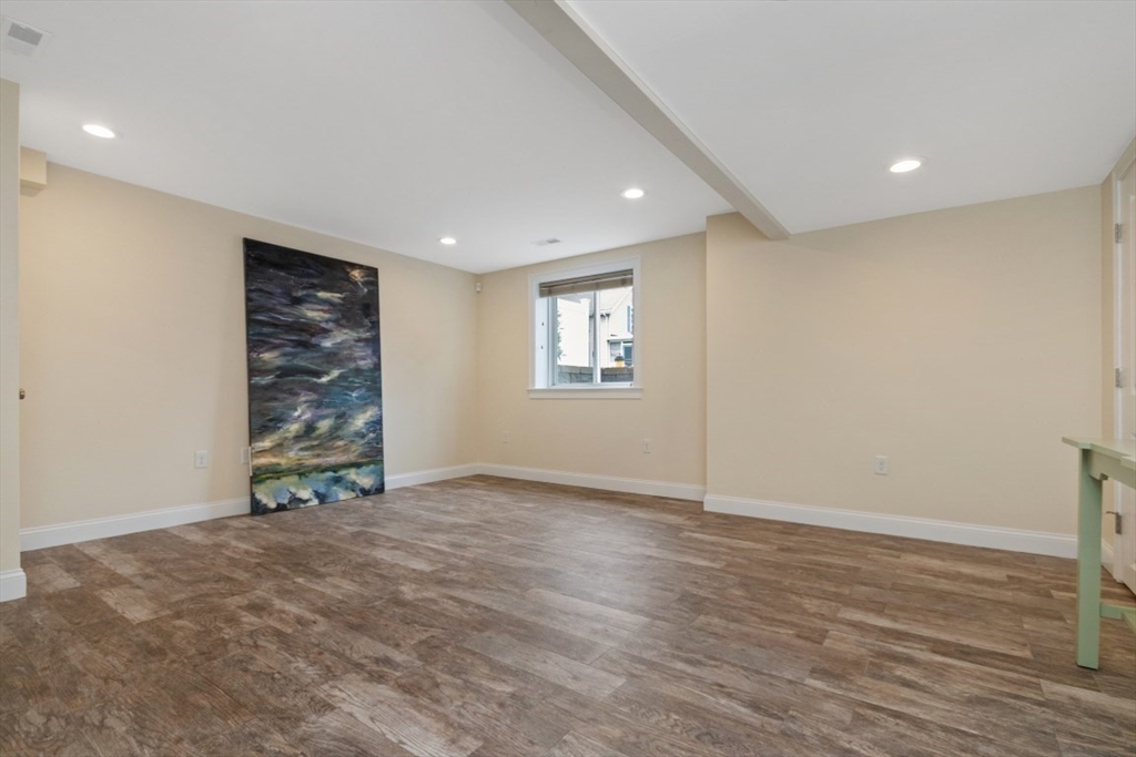 141 Ash Street, Unit 1 Waltham, MA 02453 - Photo 27 of 31 a view of an empty room with a window