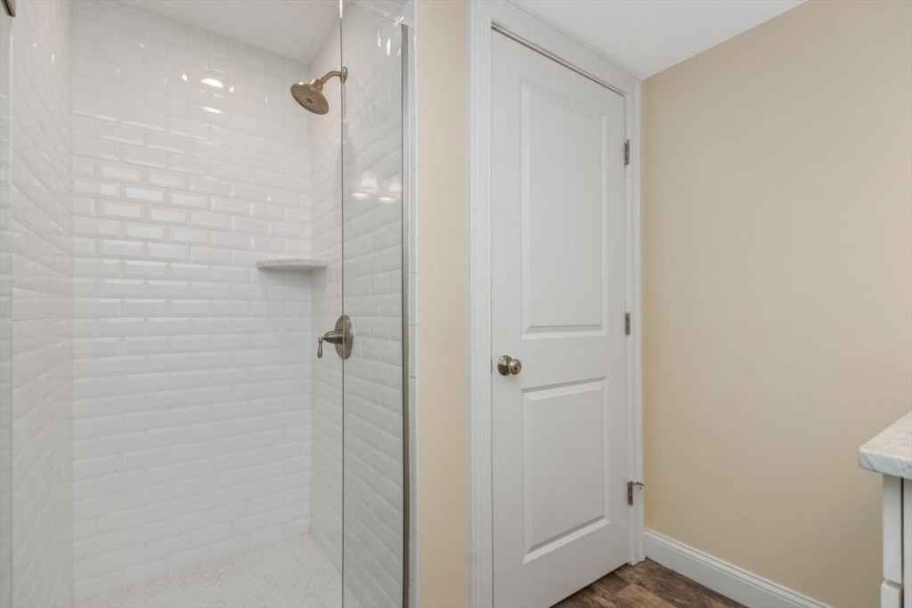 141 Ash Street, Unit 1 Waltham, MA 02453 - Photo 28 of 31 a bathroom with a shower