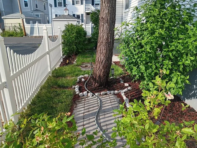a view of a chair and table in the house