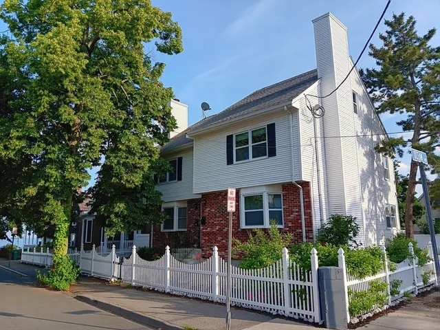 a view of front door with a chair and front door