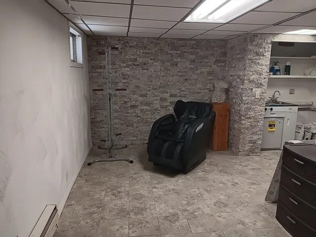 a white toilet sitting next to a bathroom sink