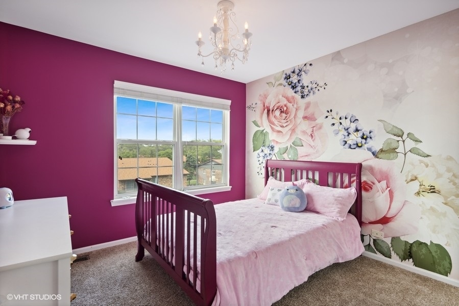 1052 Kufrin Way Lombard, IL 60148 - Photo 11 of 16 a bedroom with a bed and a window