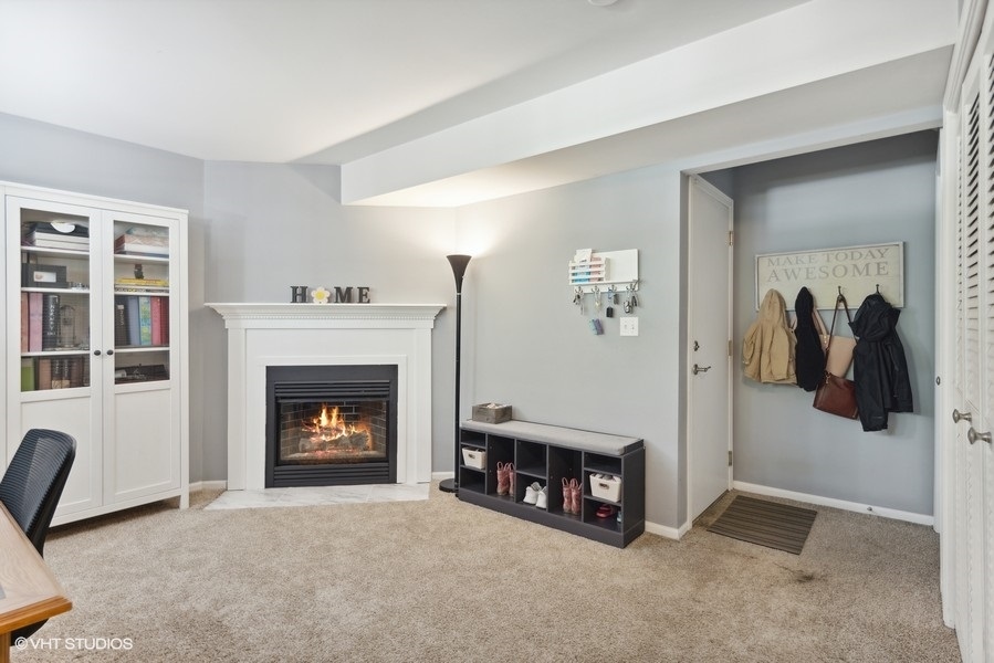 1052 Kufrin Way Lombard, IL 60148 - Photo 7 of 16 a living room with furniture and a fireplace