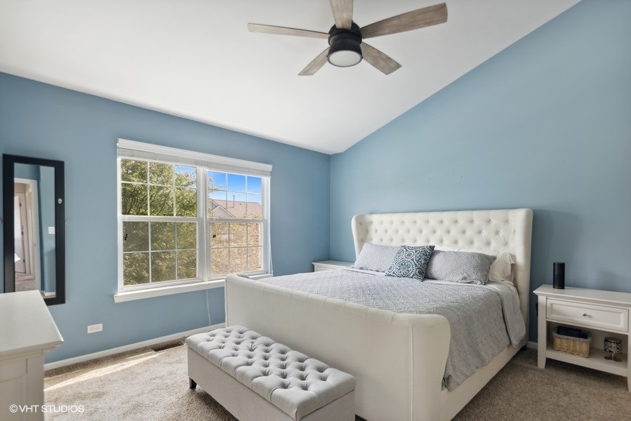 1052 Kufrin Way Lombard, IL 60148 - Photo 8 of 16 a bedroom with a bed and a window