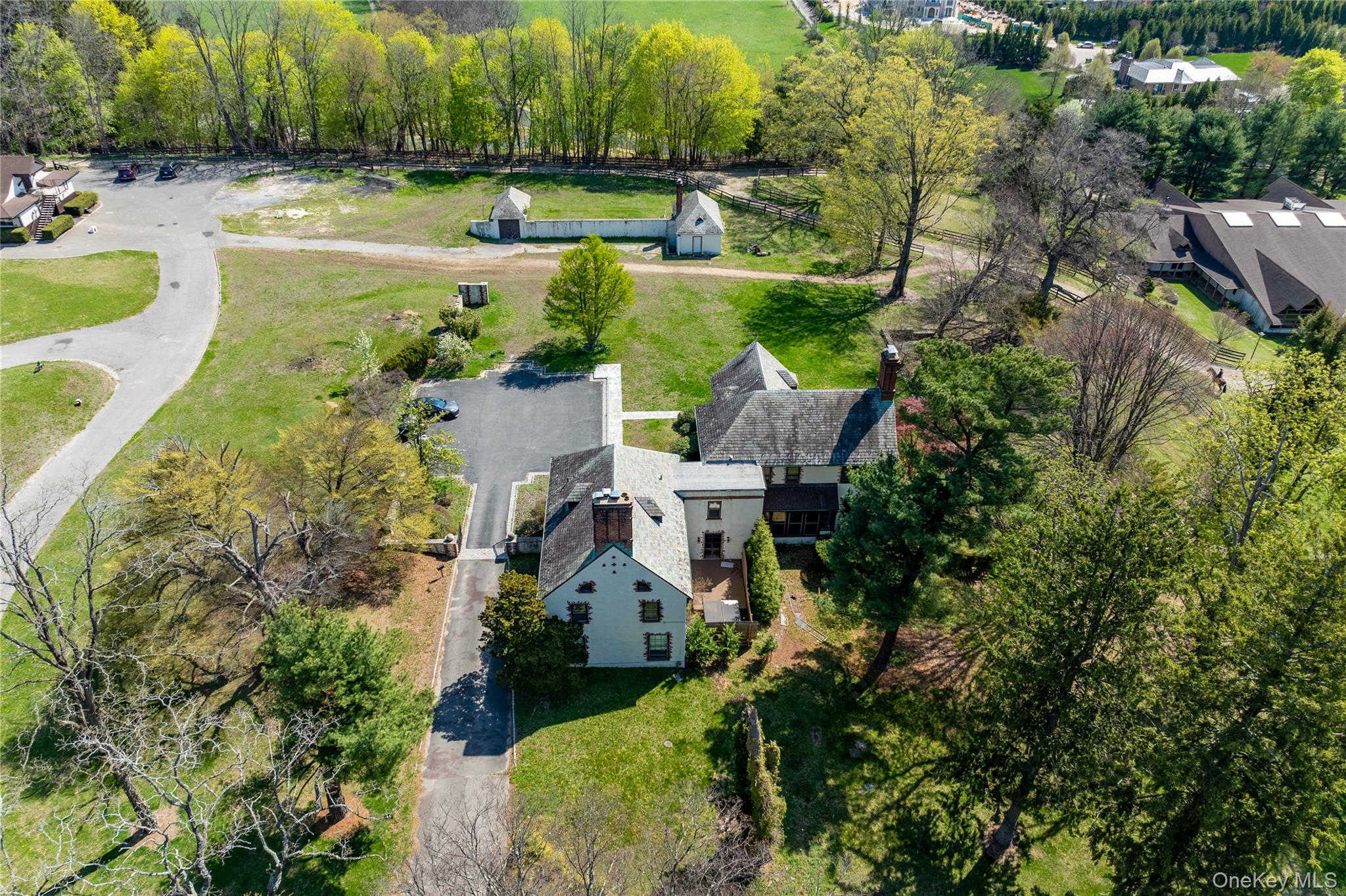 203 Store Hill Road Old Westbury, NY 11568 - Photo 11 of 50 an aerial view of a house with a yard and lake view