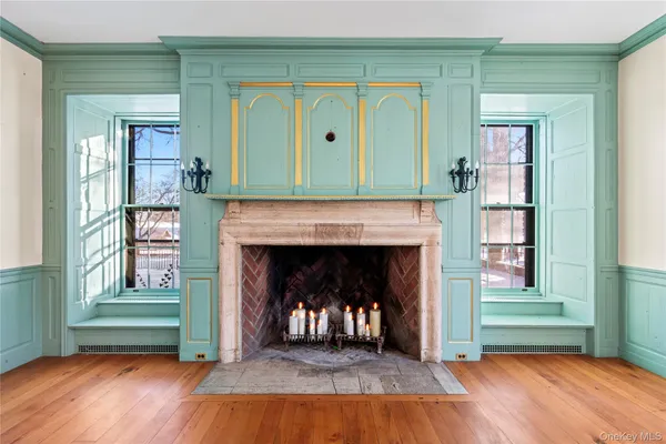 a view of livingroom with fireplace and wooden floor