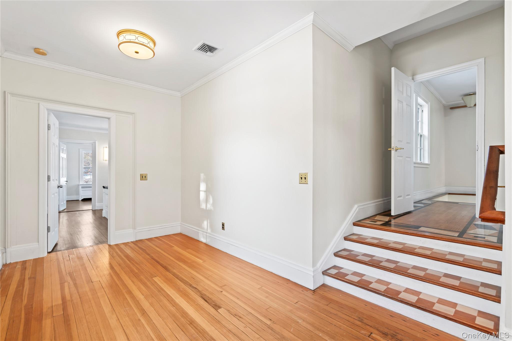 203 Store Hill Road Old Westbury, NY 11568 - Photo 24 of 50 a bedroom with a bed and a view of bathroom