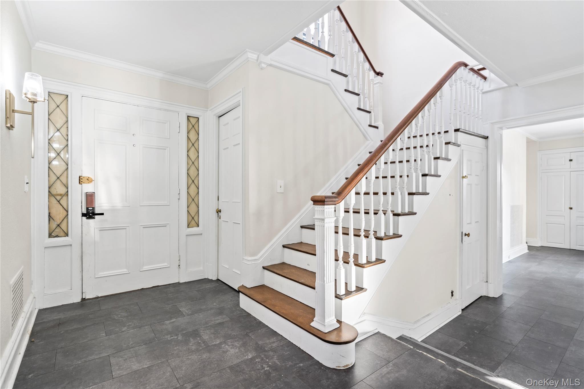 203 Store Hill Road Old Westbury, NY 11568 - Photo 30 of 50 a view of entryway with stairs and wooden floor