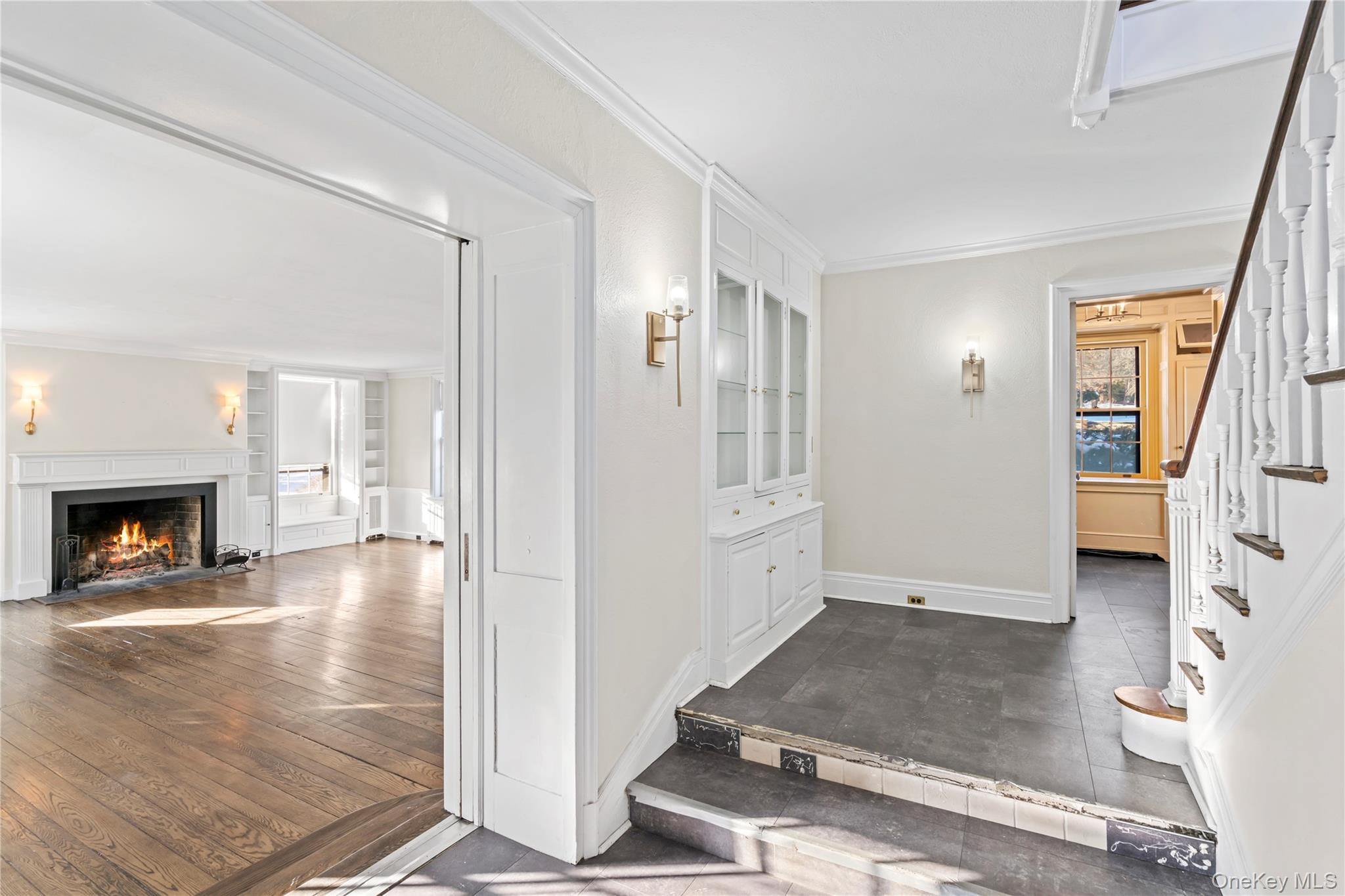 203 Store Hill Road Old Westbury, NY 11568 - Photo 32 of 50 a view of a livingroom with wooden floor and a fireplace