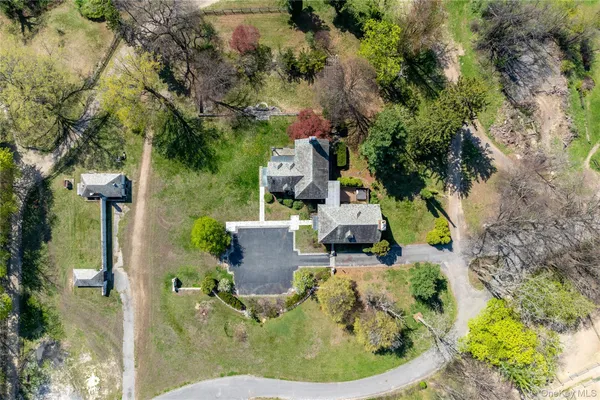 an aerial view of a house with outdoor space