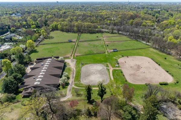 an aerial view of a golf course with parking space