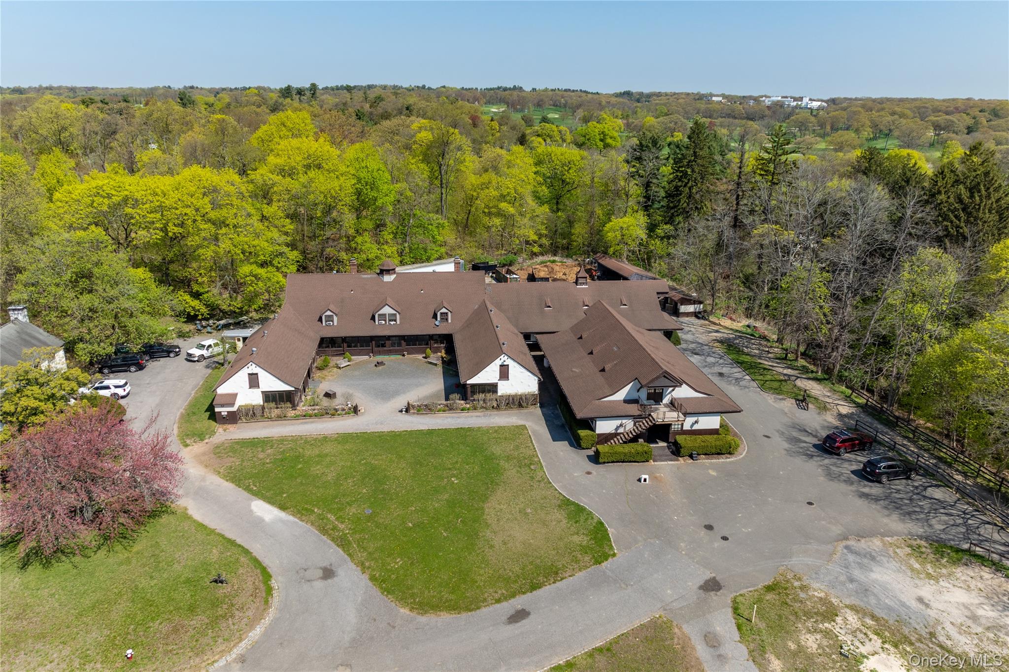 203 Store Hill Road Old Westbury, NY 11568 - Photo 47 of 50 an aerial view of a house with swimming pool and mountains