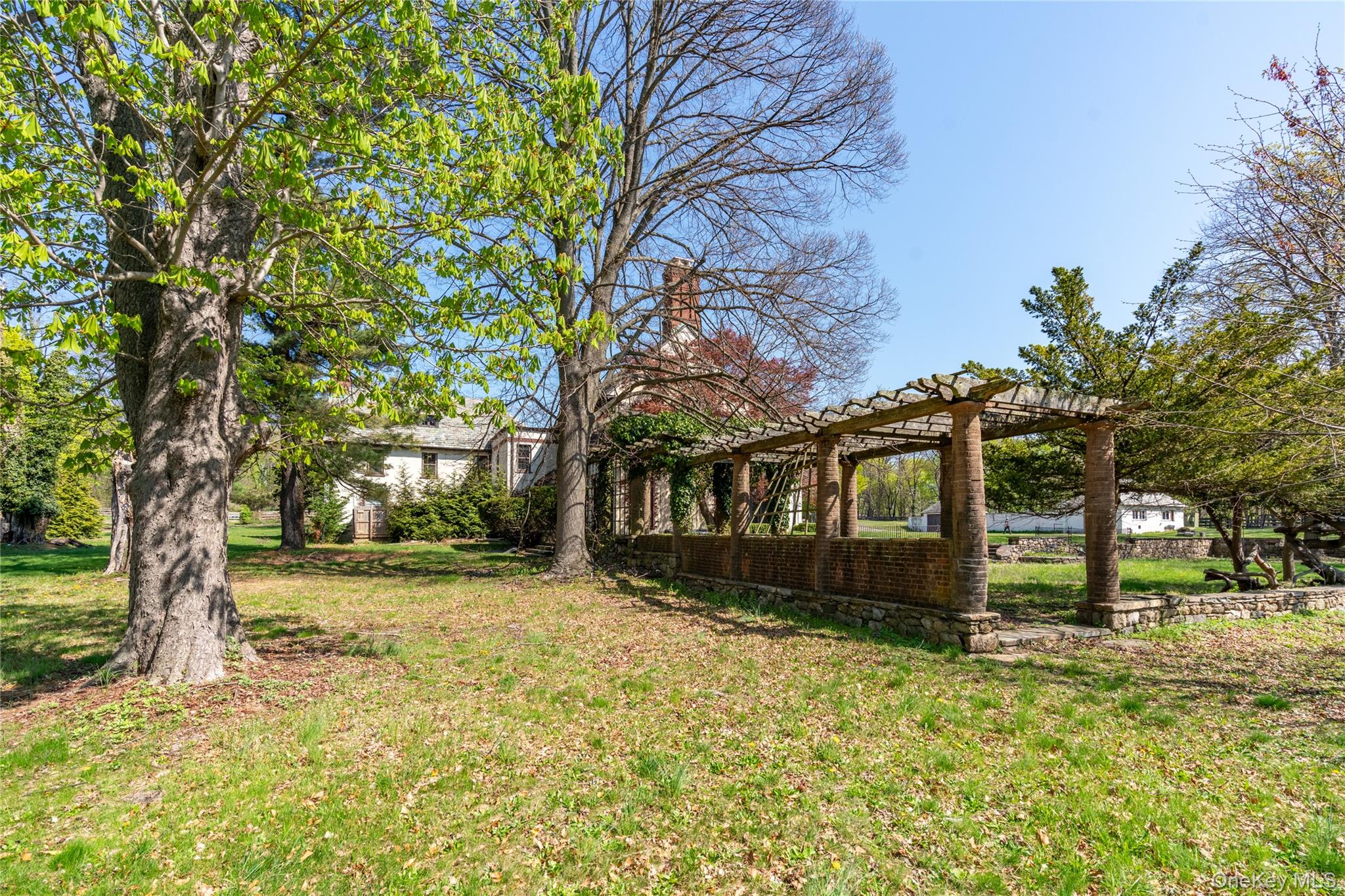 203 Store Hill Road Old Westbury, NY 11568 - Photo 5 of 50 a view of a house with a yard