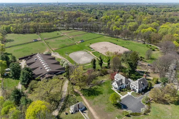 an aerial view of a houses with a yard