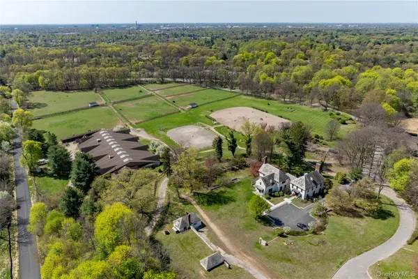 an aerial view of a houses with a yard