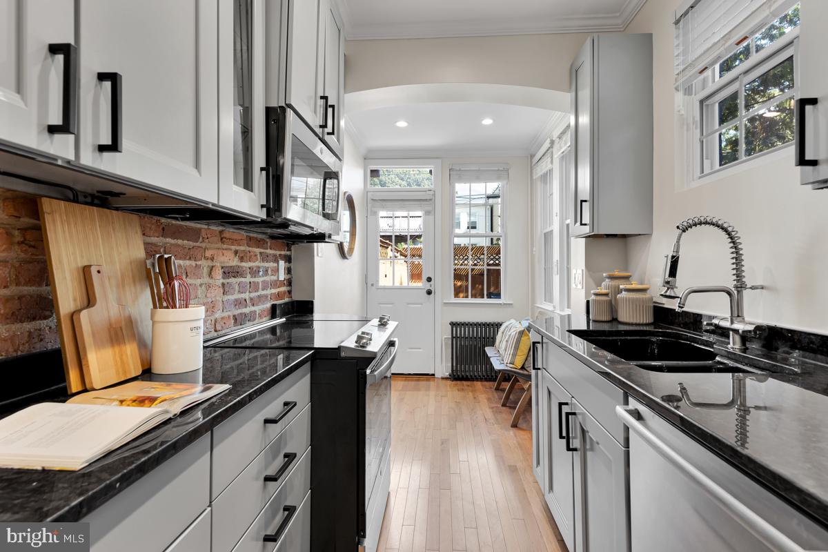 237 14th Place Northeast Washington, DC 20002 - Photo 11 of 29 Sleek gray cabinets accented with black hardware
