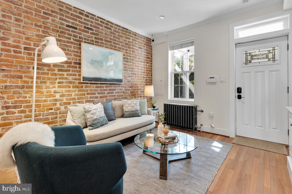 237 14th Place Northeast Washington, DC 20002 - Photo 5 of 29 Charming exposed brick in living room