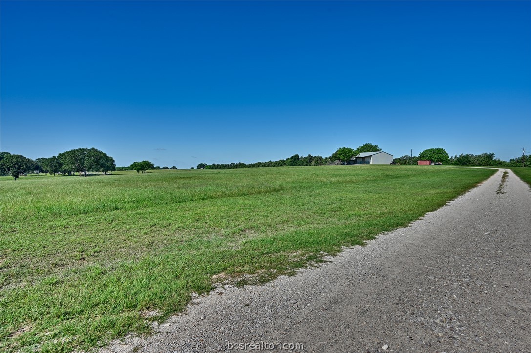 126 South Berlin Road Brenham, TX 77833 - Photo 7 of 30 a view of a grassy field with trees