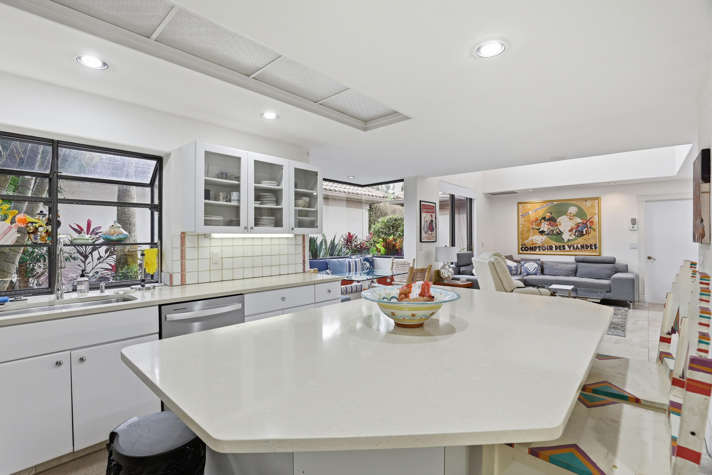 2248 Northwest 60th Street Boca Raton, FL 33496 - Photo 17 of 70 a large white kitchen with a table and chairs in it