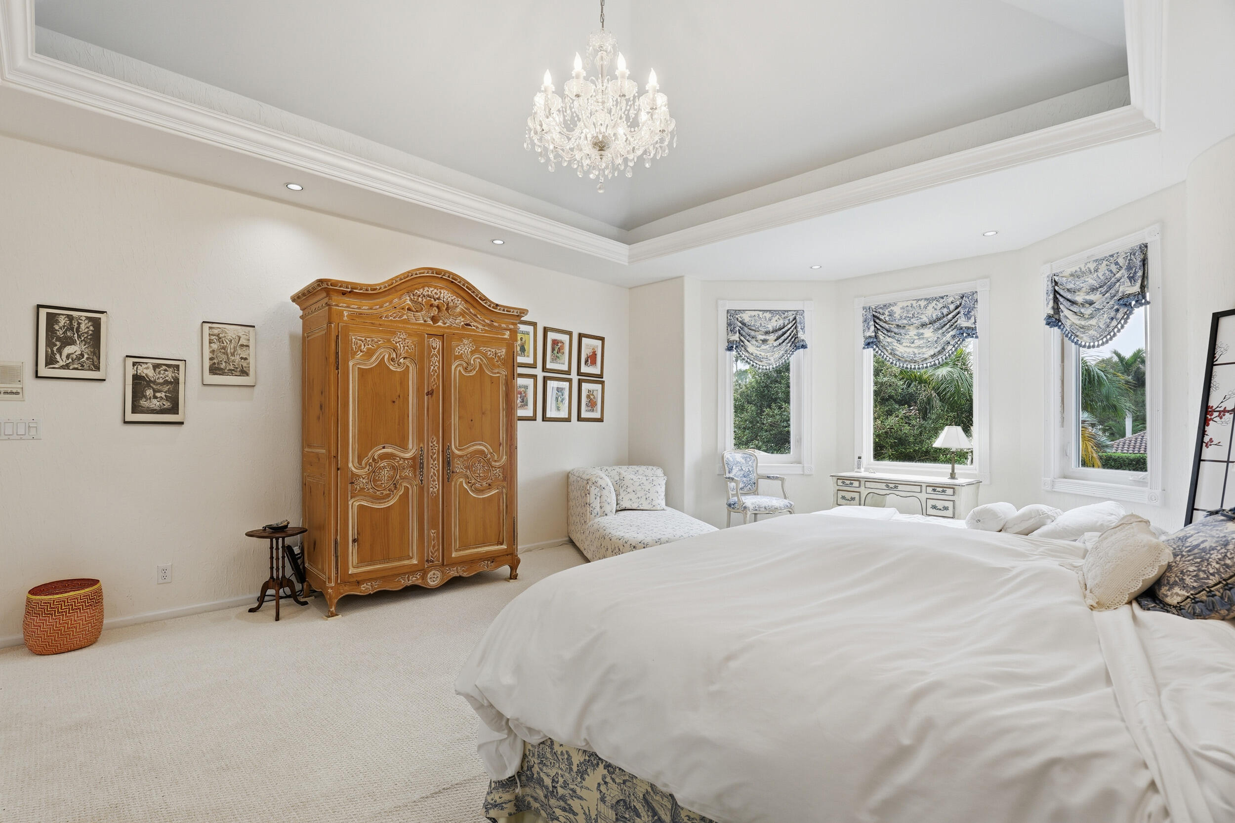 2248 Northwest 60th Street Boca Raton, FL 33496 - Photo 33 of 70 a spacious bedroom with a bed and a chandelier